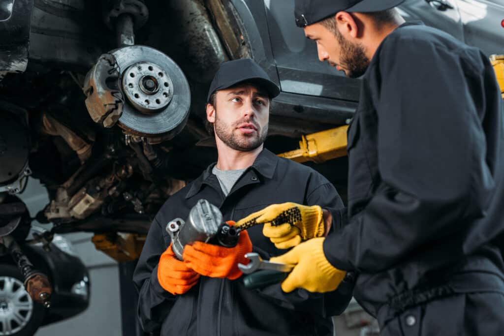 Choosing the Right Mechanic
Auto mechanics working with car and tools in workshop
